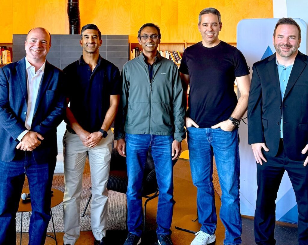 photo of five speakers at the event